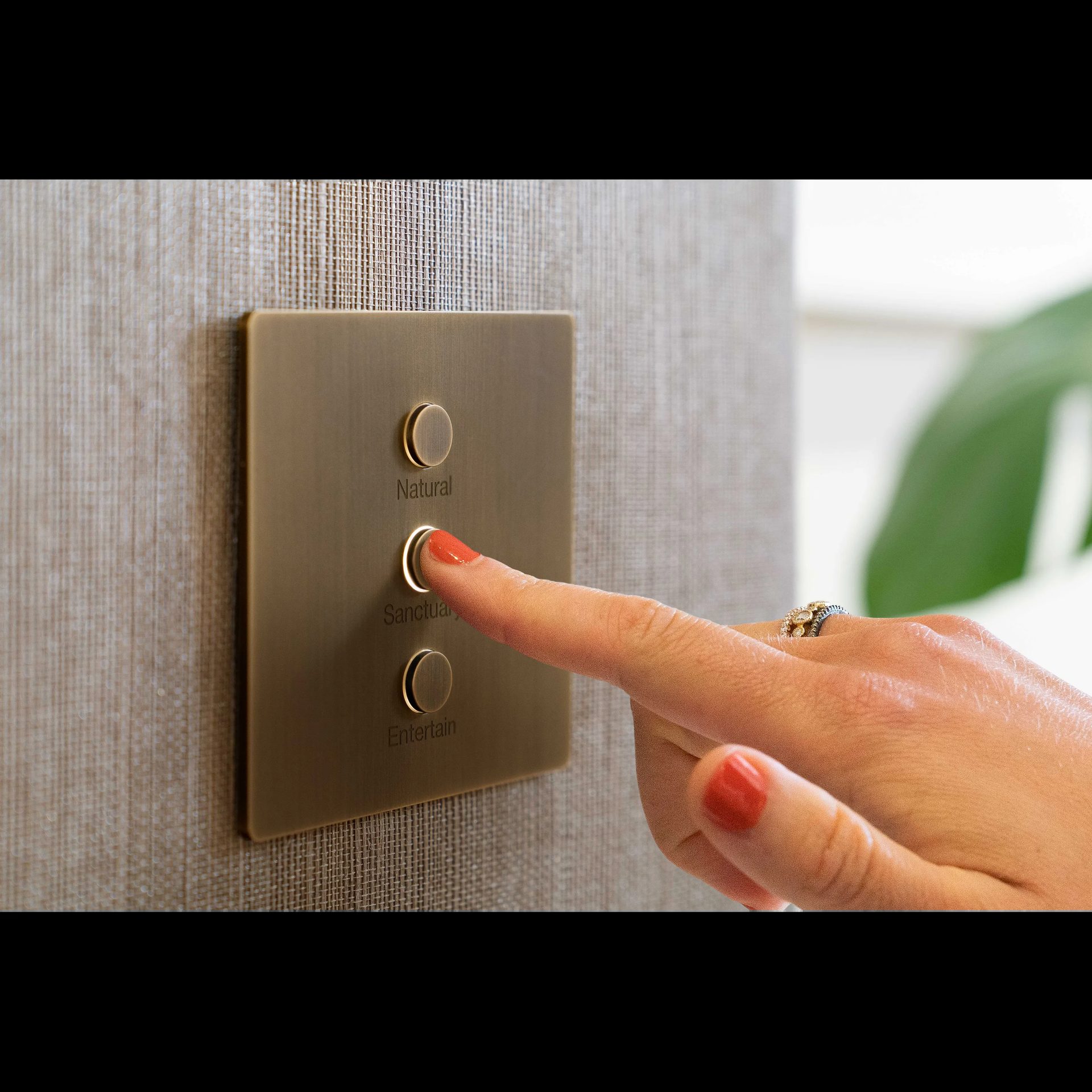 Savant brass scene controller keypad with Natural Sanctuary Entertain buttons